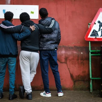 Three guys reading the warnings