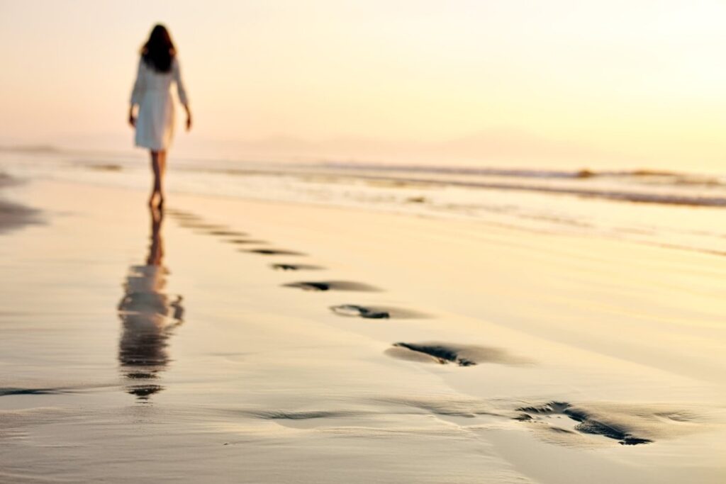 A lady walking on shore