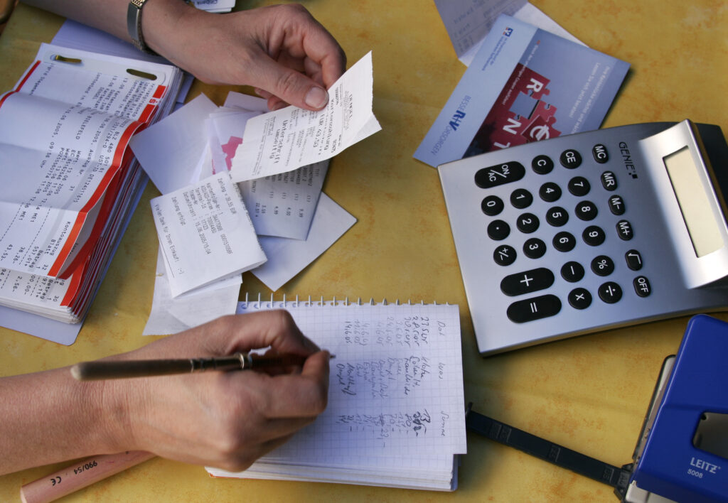 Woman doing accounts / accounting / financial accounts