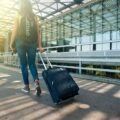 A young lady traveling through the airport