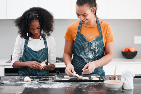 Gen Z cooking essential meals in the kitchen