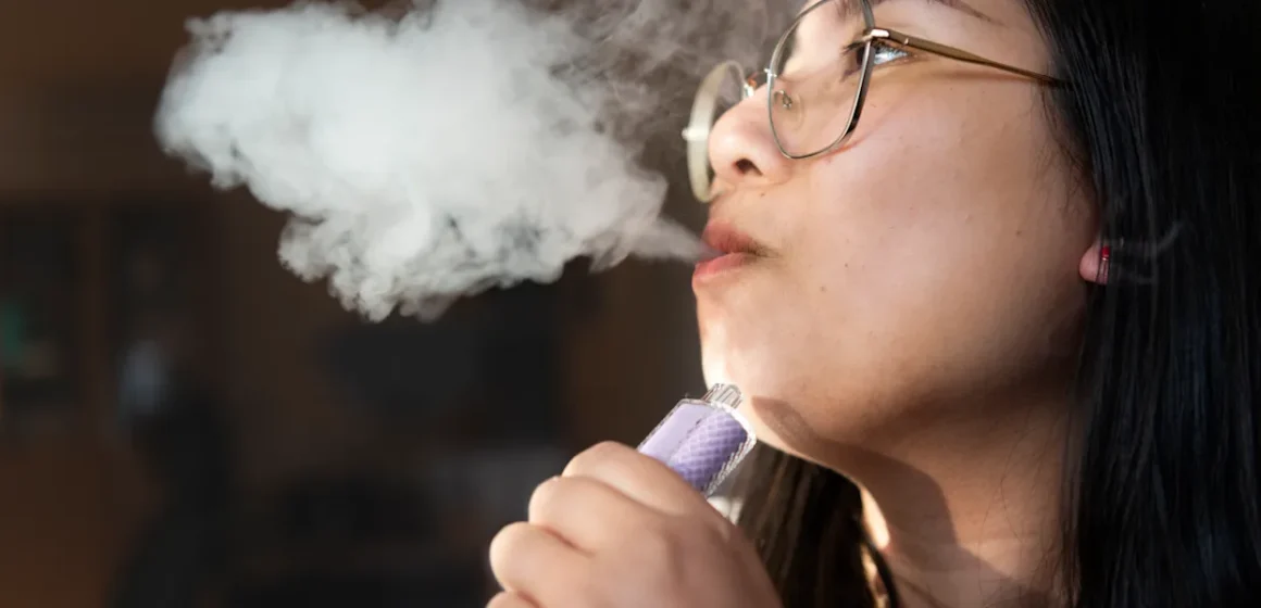A young girl vaping