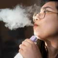 A young girl vaping