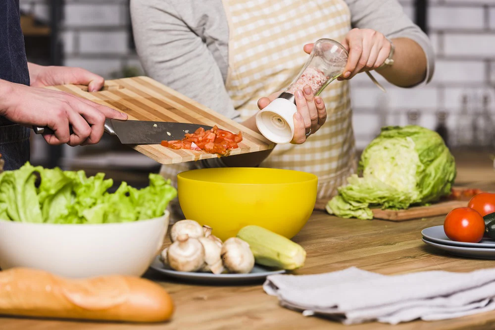 Gen Z cooking essential meals in the kitchen
