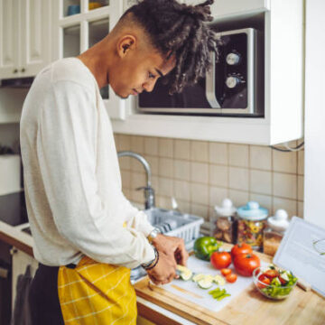 Gen Z cooking essential meals in the kitchen