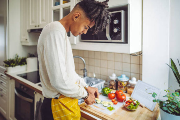 Gen Z cooking essential meals in the kitchen
