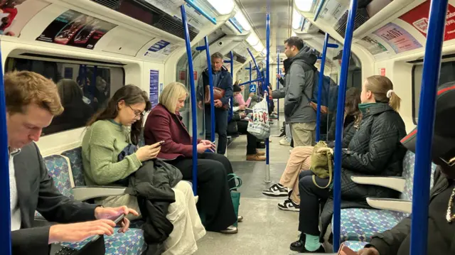People on the underground TFL services. 