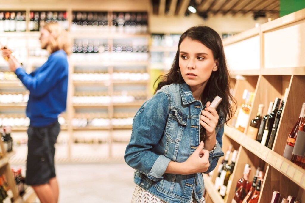 A young person stealing- showcasing Kleptomania in the act 