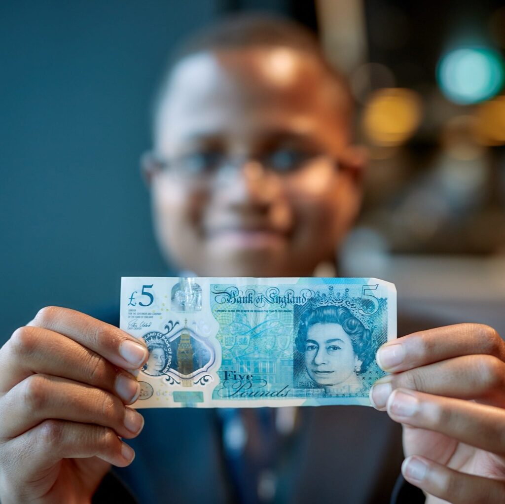Smart Money Summer, shows a young person saving 