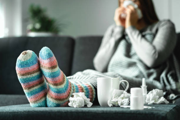 istockphoto-1124732633-612x612 woman on the sofa sick from the flu season