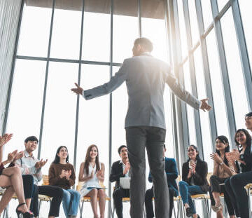 An employee doung a presentation as a way to impress your employer