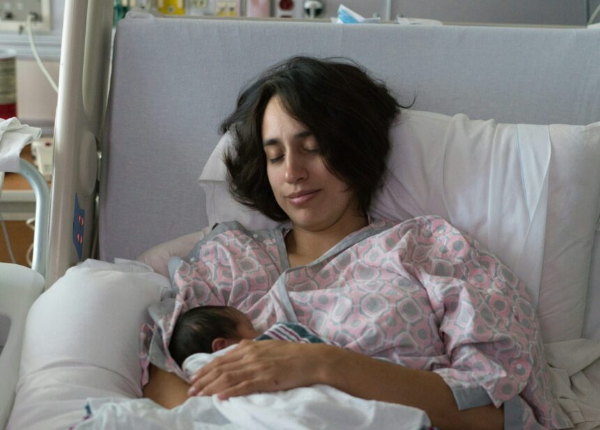 Woman with new born baby in the maternity ward. Photo Credit: Brian Wangenheim on Unsplash