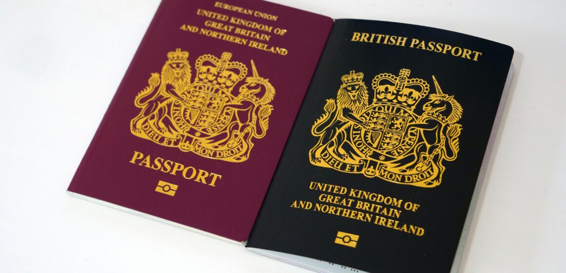 ethan-wilkinson-xYtbsEI11tw-unsplash A photo of an old UK passport, (when the UK was a part of the EU), and new UK passport.