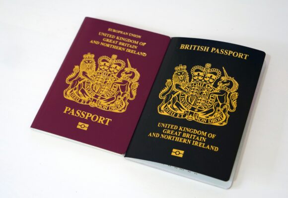 A photo of an old UK passport, (when the UK was a part of the EU), and new UK passport.