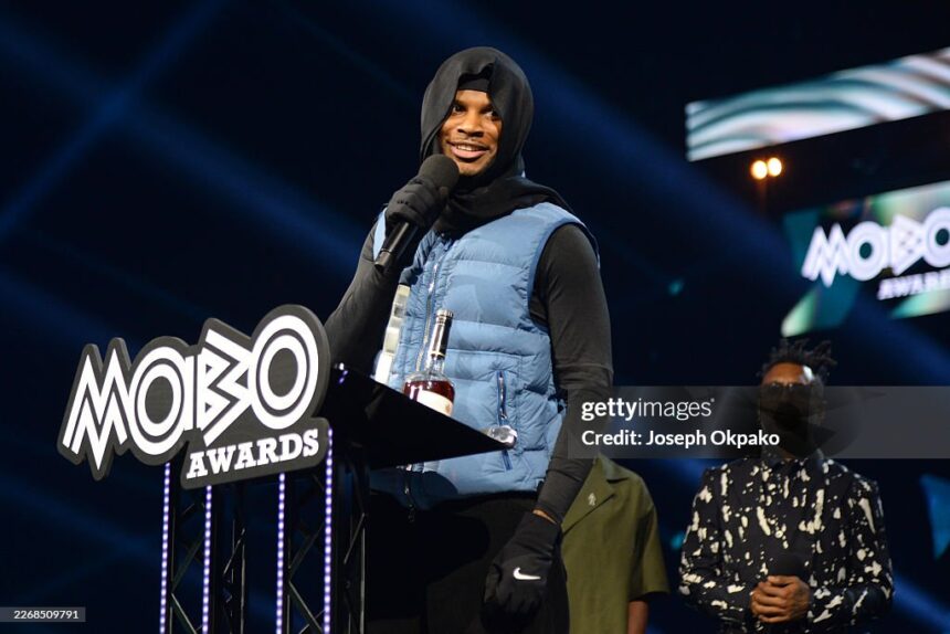 Photo of Jim Legxacy performing a speech at the 2026 Mobo Awards