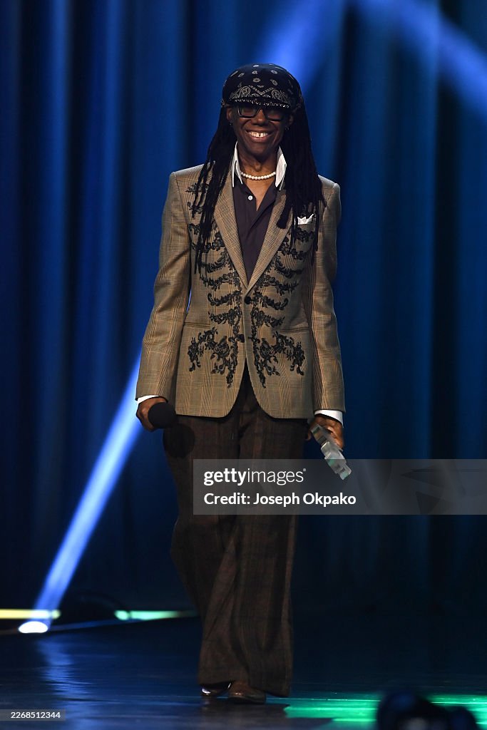 MANCHESTER, ENGLAND - MARCH 26: Nile Rodgers present the Mobo Global Songwriter Award onstage during the 2026 MOBO Awards at Co-op Live on March 26, 2026, in Manchester, England. (Photo by Joseph Okpako/Getty Images for MOBO)