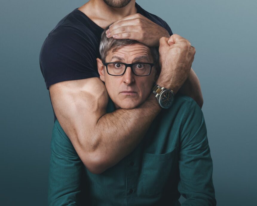 Louis Theroux in a headlock.