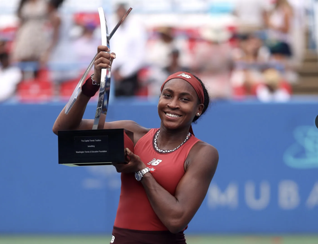 American professional tennis player Coco Gauff raising the victory trophy at the DC Open in Washington, D.C., in August 2023