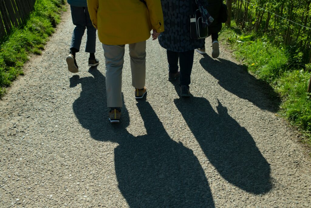 Photograph of people walking.