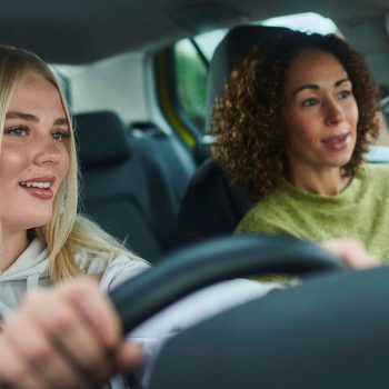 Mother and daughter inside car