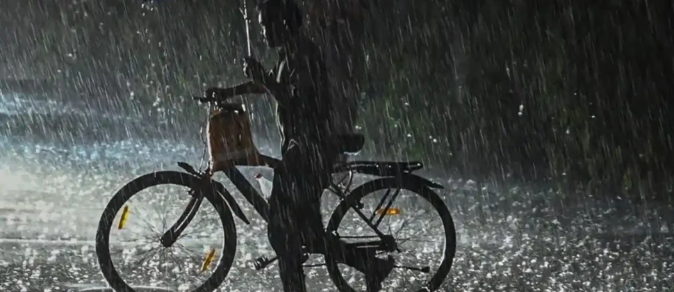 People struggling with umbrellas in torrential rain and gale-force gusts