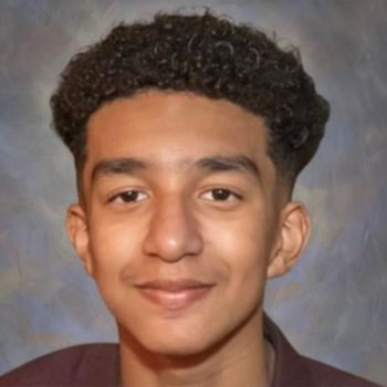 A lonely teenager sitting in the dark with a glowing phone screen — AI chatbot dangers for youth and emotional attachment risks