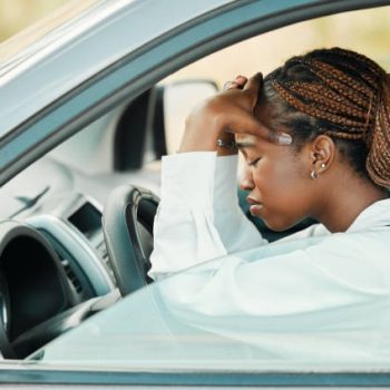 Young person stressed from learning how to drive to show why less young people are choosing to get their drivers license